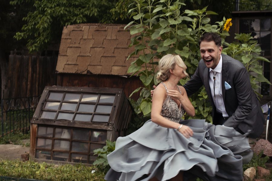 Jake and Sam laughing on their wedding day